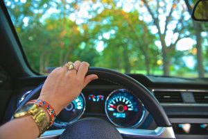 woman driving next to a semi truck safely